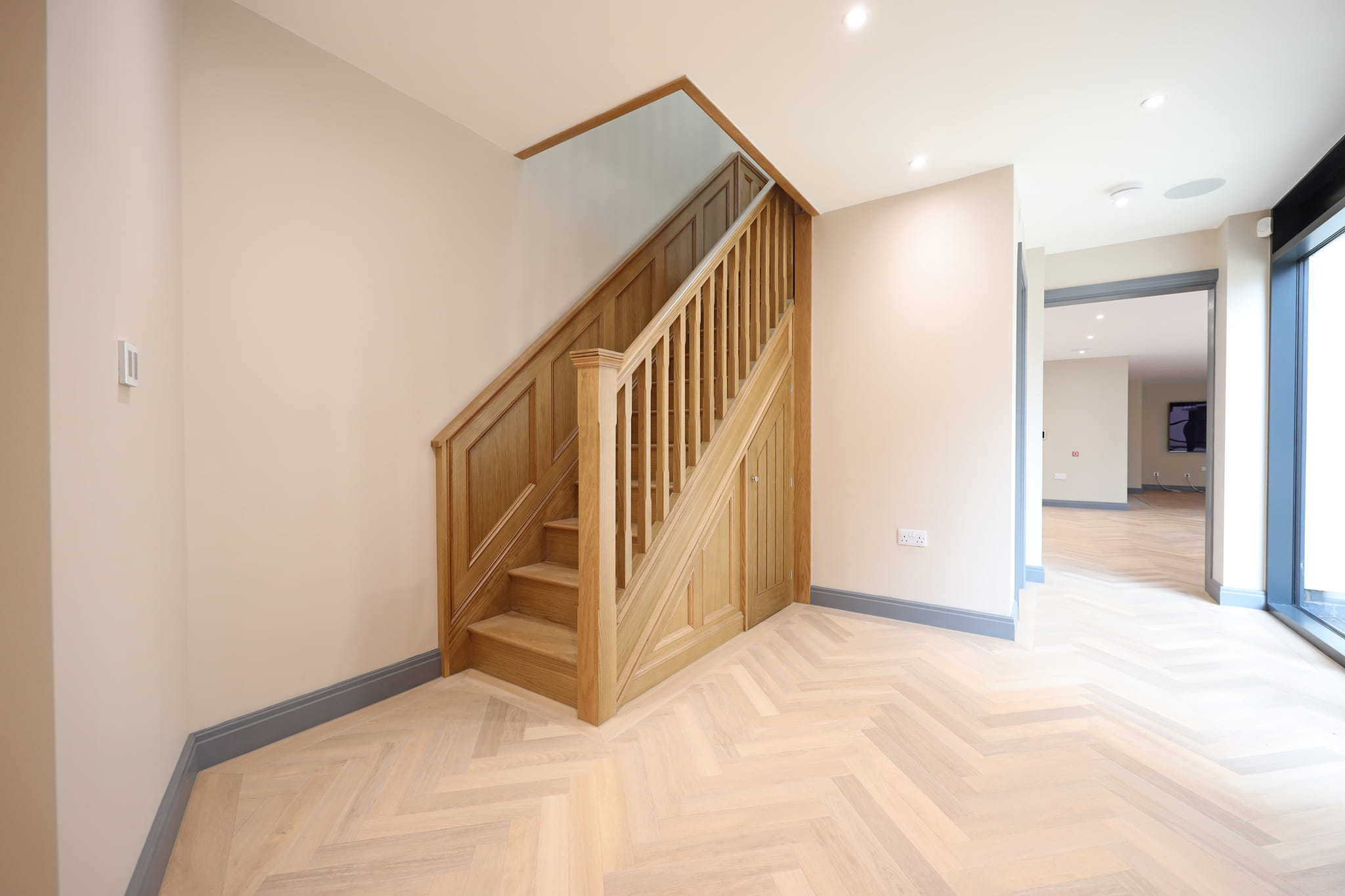 Misura Joinery bespoke oak staircase — custom timber staircase with under-stair storage